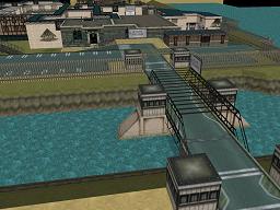 Click to view large image Fortified bridge crosses the prison’s moat. Small gatehouses guard the carpark, with main entrance building beyond.